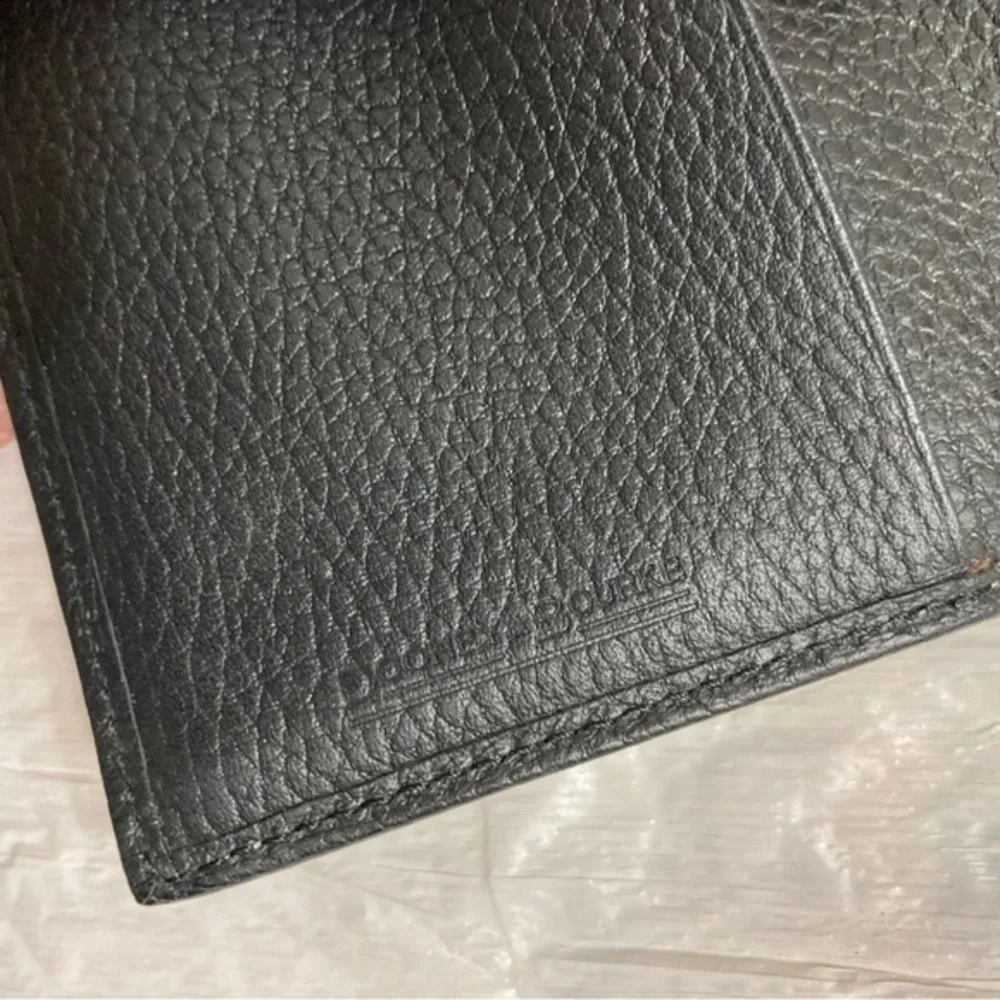 Dooney and Bourke rare perforated black pebbled leather 2 piece wallet set